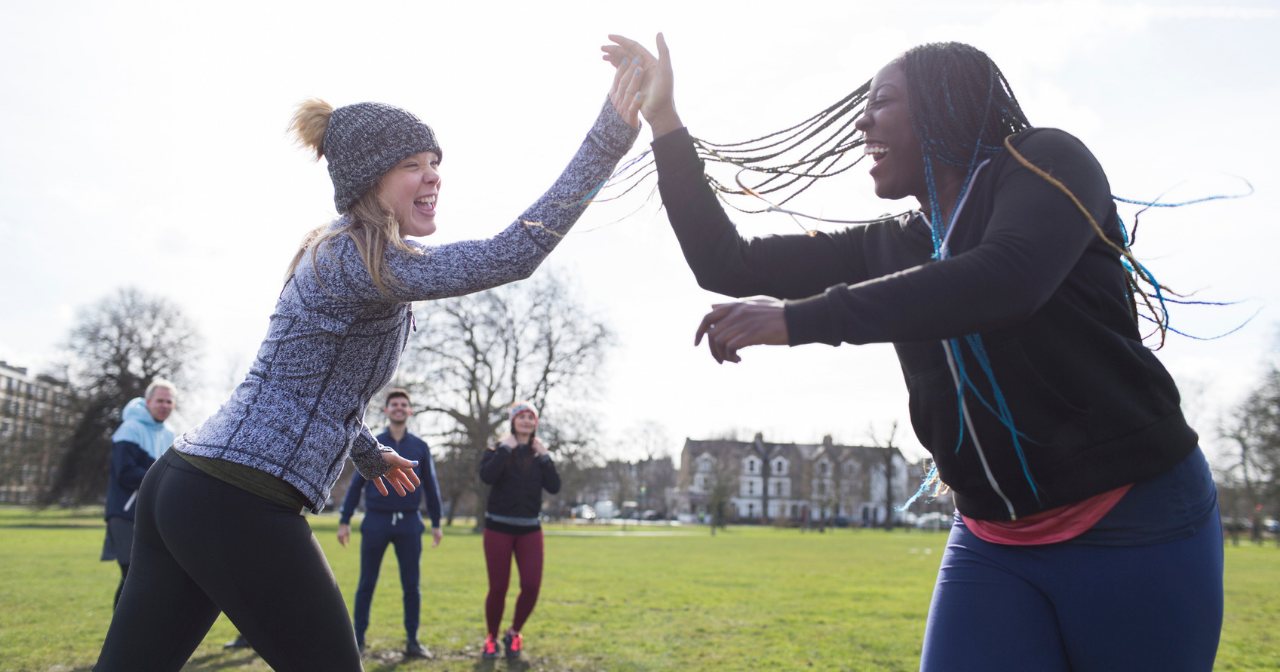 an image of two women high fiving
