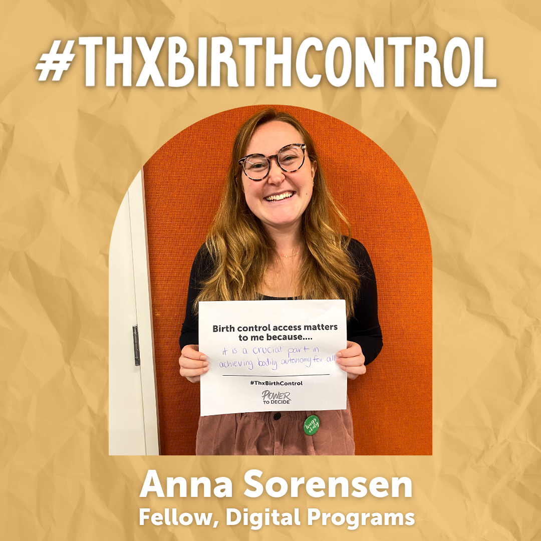 A Power to Decide Staffer holds a sign with their reason for saying #ThxBirthControl.