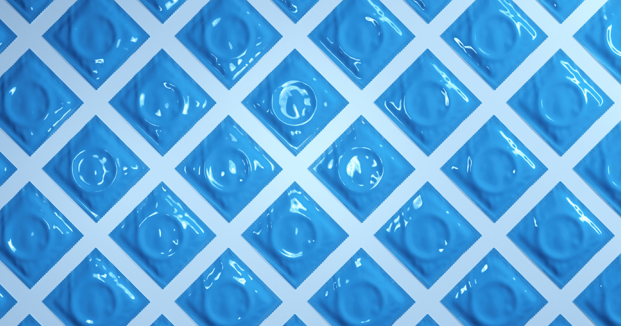 A photo of blue condoms laid out in rows. 
