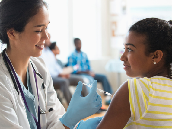 Provider gives young woman HPV shot