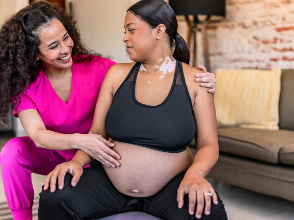 Doula assisting pregnant woman