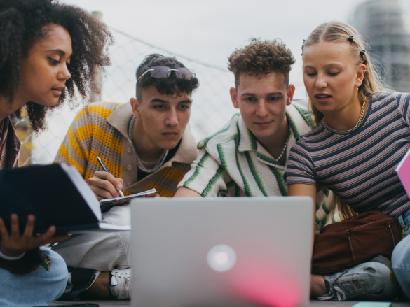 Friends looking up birth control information in a computer